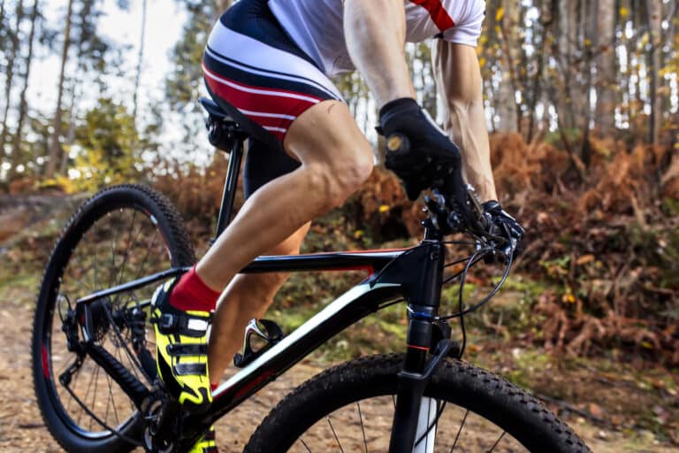 mountain biker driving in the forest, close up