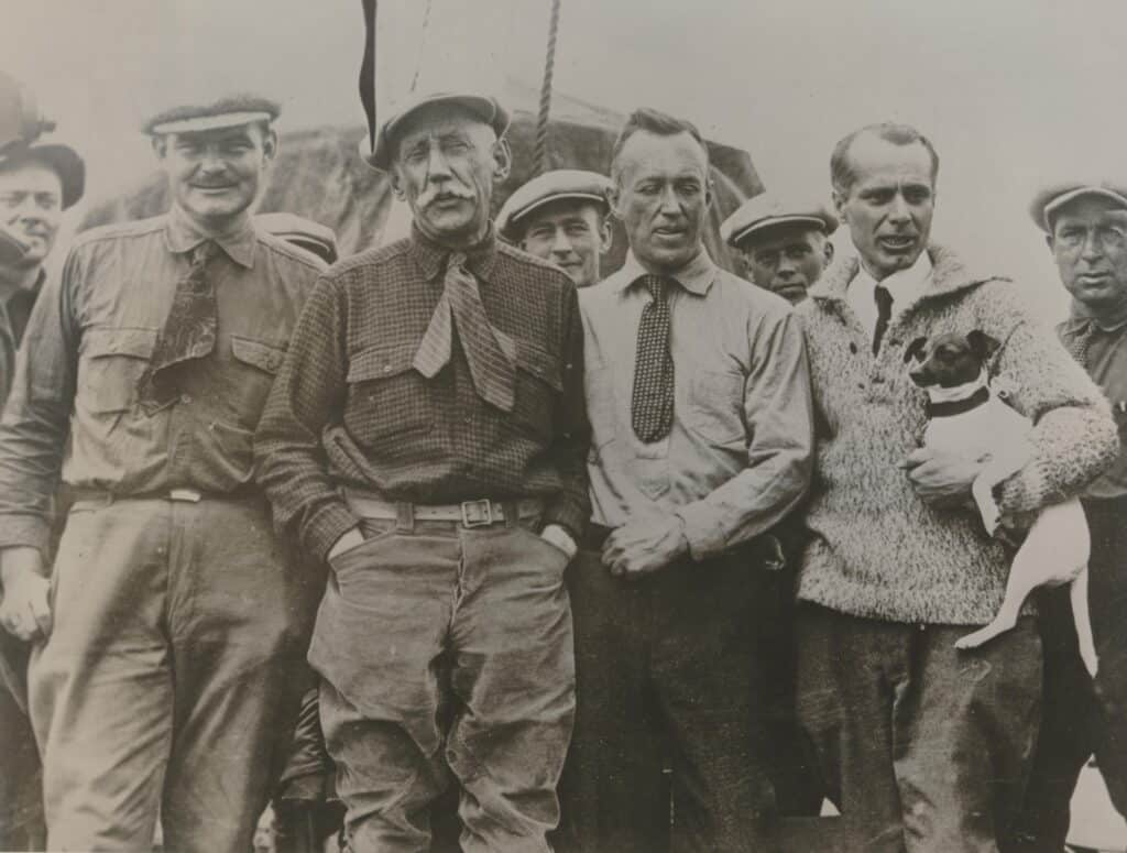  From Norway the North Pole has been thorougly explored. This picture shows one of the high lights of this work, the arrival in Seattle, Washington after the flight over the North Pole with Norge. From left-to-right: H. Riiser-Larsen, now Admiral in the Norwegian Air Force, Roald Amundsen, who died in 1928 during his search for Nobile, who had not come back from his trip to the North Pole with "Italia", Lincoln Ellsworth, and General Nobile.