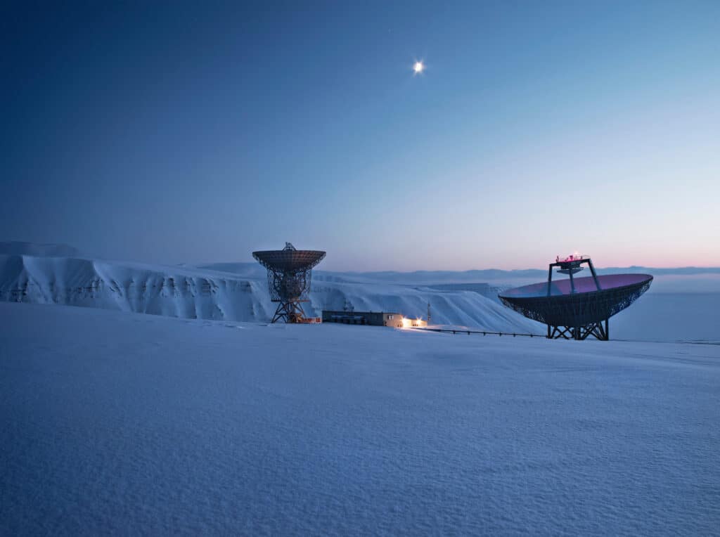 satellite dishes in snowy landscape